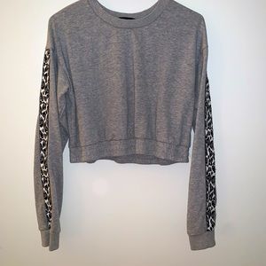 KITTENISH Cropped Leopard Sleeve Sweatshirt